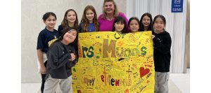 Sauganash principal pictured with students