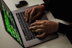Image of Hands Typing on Laptop.